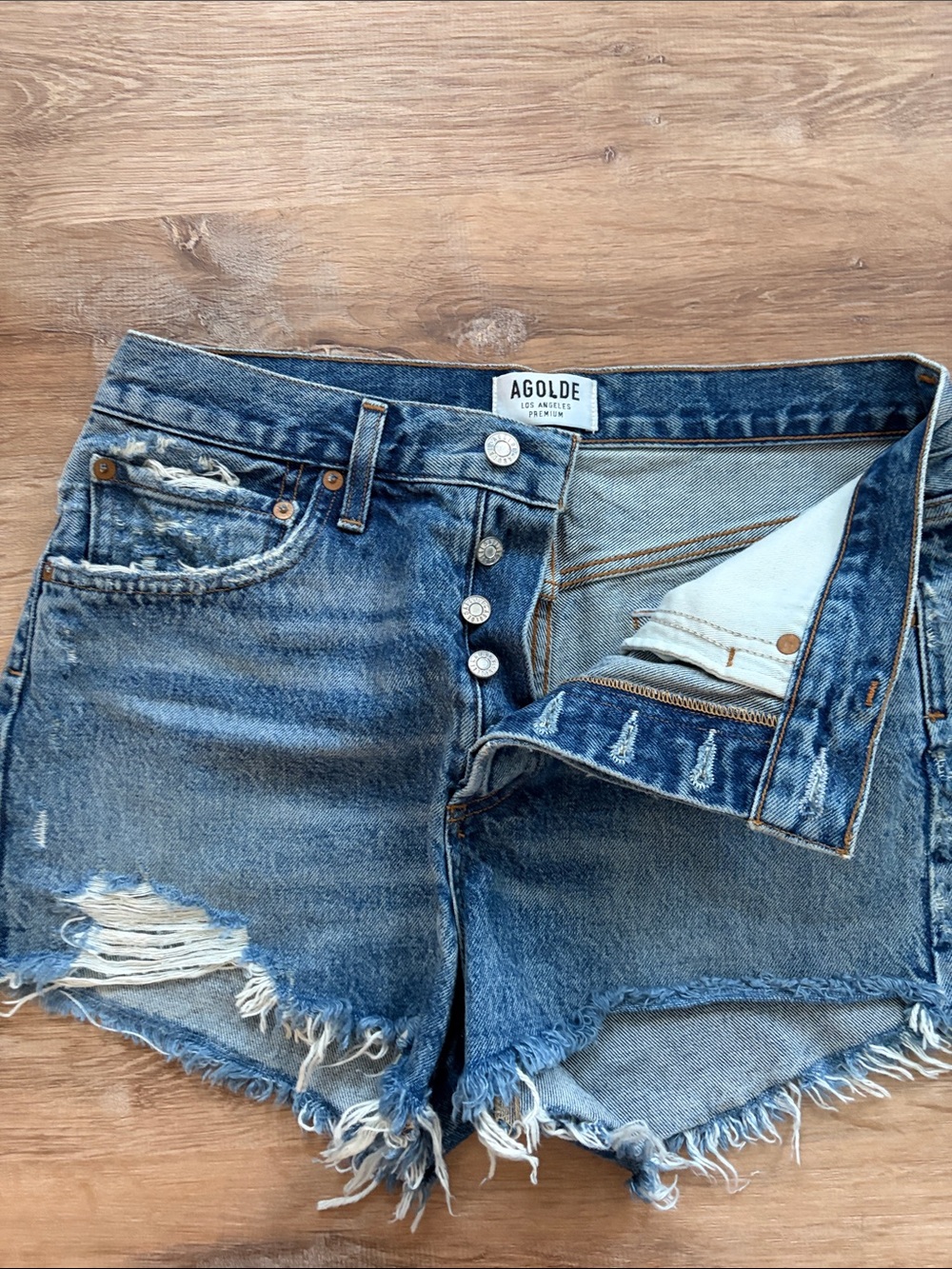 Agolde Medium Blue Distressed Denim Cutoff Shorts